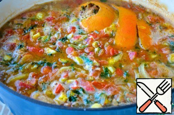 Add the tomatoes and simmer, stirring occasionally, for another 10 minutes. Then pour in the water and broth, add the orange zest, bring to a boil, reduce the heat and simmer for 30 minutes.
