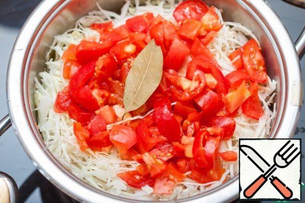 Aaa chopped cabbage and sliced tomatoes, Bay leaf.