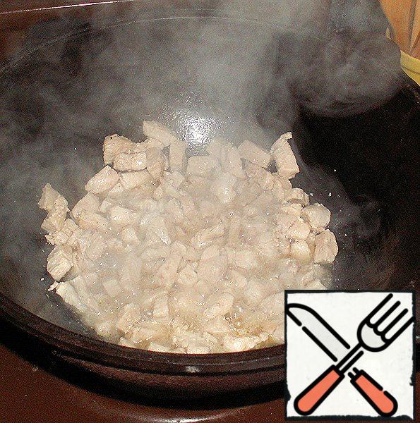 In a cast-iron cauldron, heat the oil and fry it on a finely chopped breast.