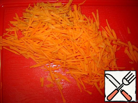 Carrots cut into strips. If time is short, you can grate it on a coarse grater, but I like it better when it's sliced.