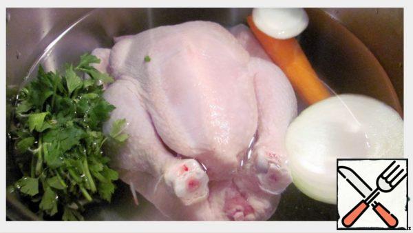 Fill the chicken with water so that it is covered. Add the onion, carrot and parsley and dill. Give to boil, remove the foam and put the stew on low heat under a lid until tender, which takes about an hour.