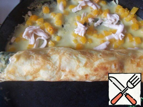 Also fry the second omelet, only at the end put the previous one on the edge and roll them together.