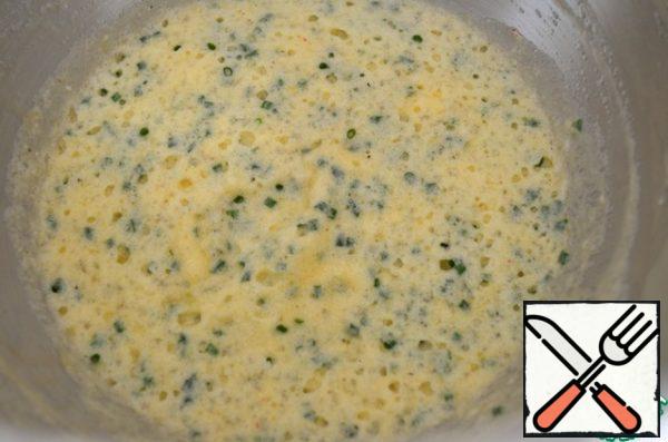 Carefully mix the whites with the yolks, add the cheese and half the Parmesan. Sprinkle with chopped chives.