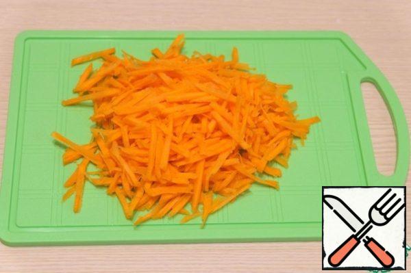 Shred carrot on the Korean grater.