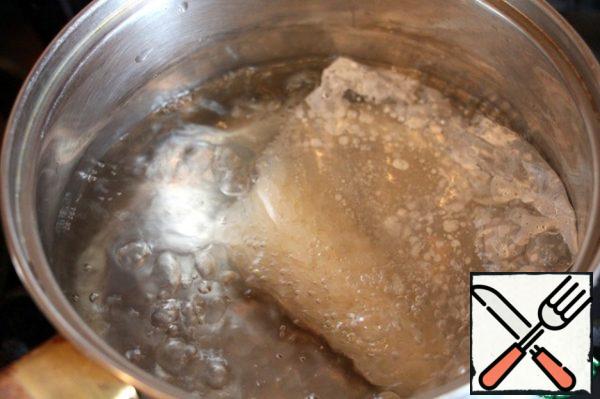 Lower the bag of rice in salted boiling water and cook until ready for 30 minutes.