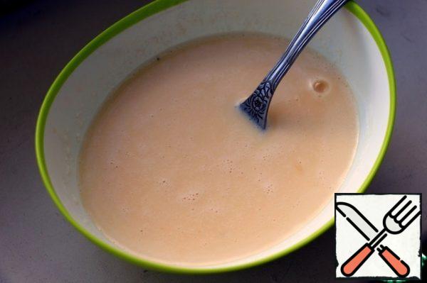 Beat eggs with cream and salt with a fork.
