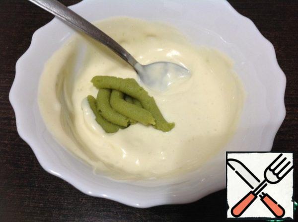 Mix mayonnaise with wasabi until smooth.
Wasabi is a Japanese horseradish that is sold as a finished paste or powder. It can be easily bought in any institution that sells rolls and sushi.
I recommend first adding a small amount of wasabi to mayonnaise, and if necessary, add more, as it is very sharp!