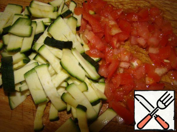 Zucchini and tomato cut.