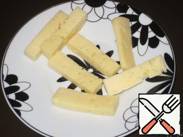 Cheese cut into horizontal bars.
