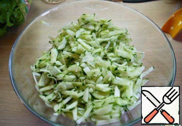 I try to peel fresh cucumbers. But it's not for everybody. Cut into strips.