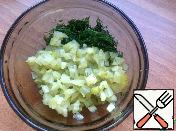 In a cup finely chop the salted cucumber into cubes, finely chop the Dill.