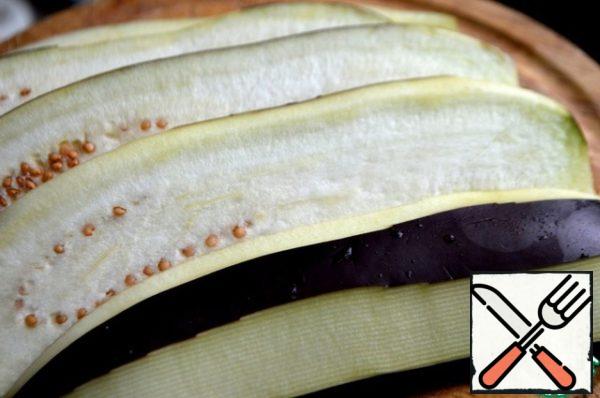 Eggplant should be cleaned and cut into plates of 0.5 cm thick.