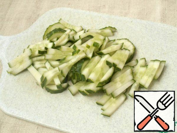 Fresh cucumber cut into strips.