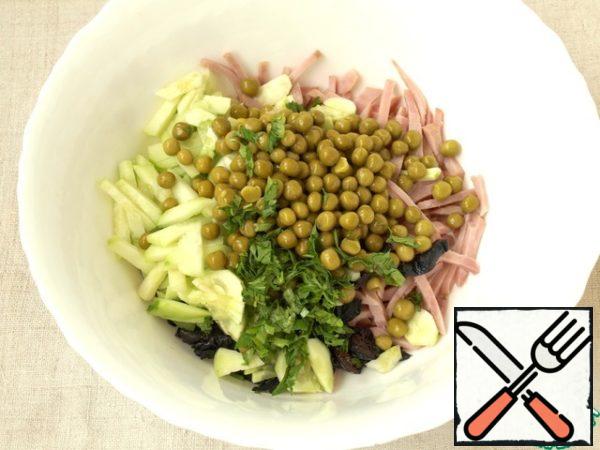 Add together in a deep a bowl cucumbers, ham and prunes. Add canned green peas and chopped parsley. Parsley can be add more than I have.