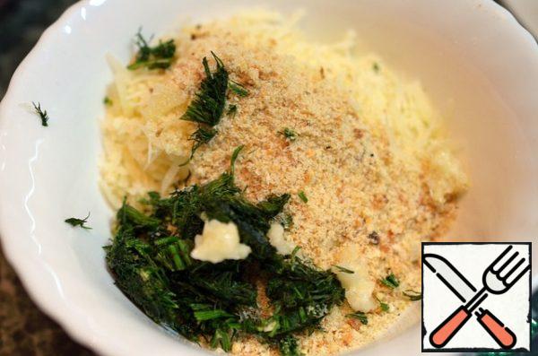 Add chopped greens, garlic and breadcrumbs. RUB your hands in the crumb.