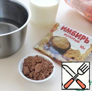 In a saucepan, mix ginger, cocoa, milk, hot water, bring the mixture to a boil on low heat, then reduce the fire to a minimum, cook stirring for 1-2 minutes.