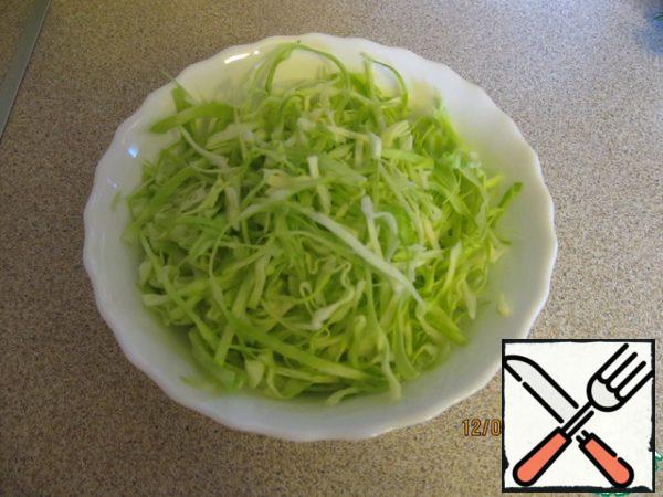 Chop the cabbage, add salt, mix with your hands and mash it to become softer and let the juice.