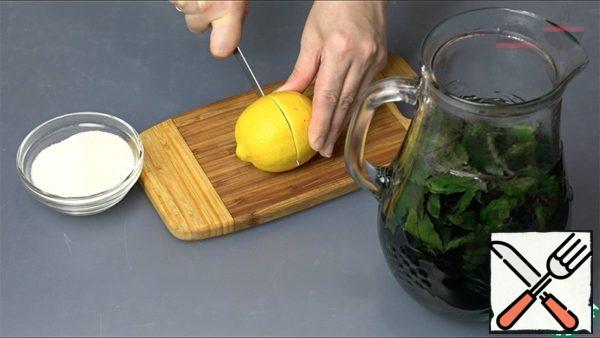 Wash the basil and put it in a jug. Pour boiling water over it. Let it brew for 20 minutes. The water will turn dark purple.
