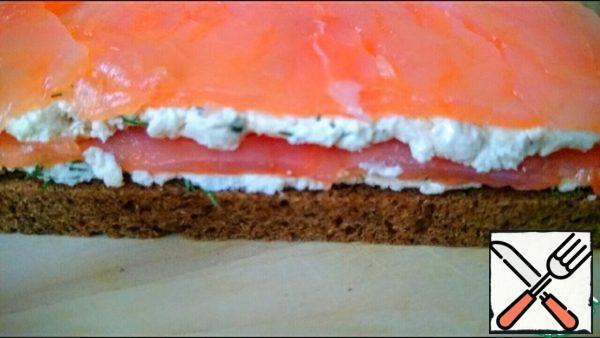 On cheese put salmon slice.
