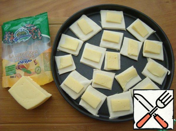 Put the cheese on the dough. Put in the oven for 10-15 minutes. Focus on your oven.
