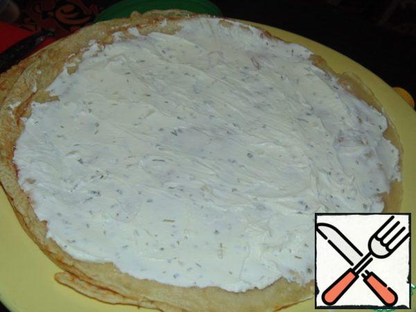 Bake 3 pancakes. Brush each pancake with cottage cheese and herbs.
