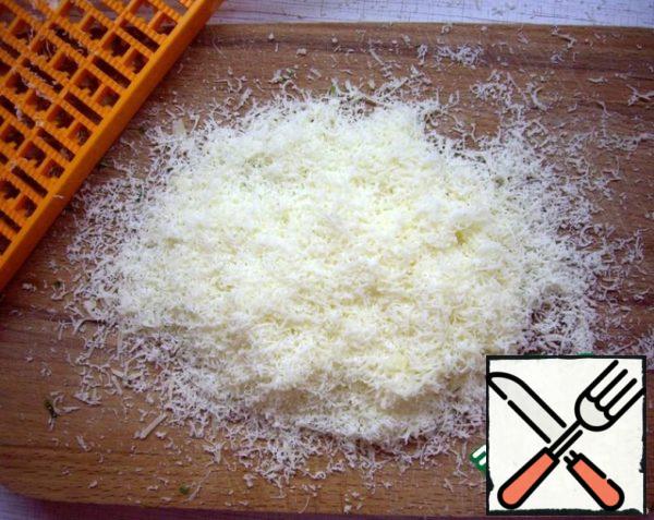 Cheese grated on a grater.