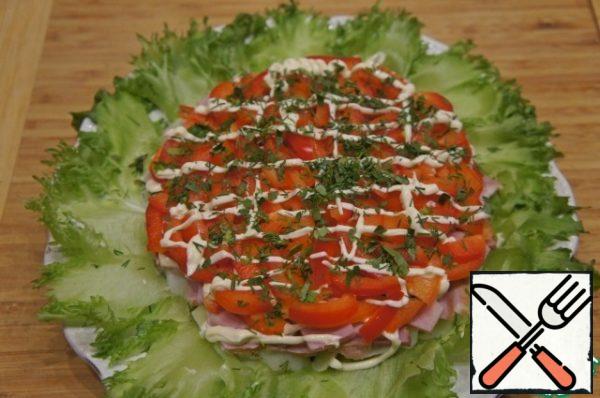 Then put the bell pepper, cut into strips, apply a mesh of mayonnaise and sprinkle with finely chopped herbs.