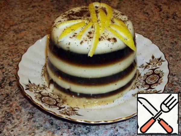 Put a layer of milk jelly in the molds, cool until solidified, then a layer of coffee jelly, cool.
Repeat the operation to get several layers of milk-coffee jelly.
Before serving, dip the mold in hot water for a few seconds, then, turning it over, put the jelly on a dish. Garnish with lemon zest.