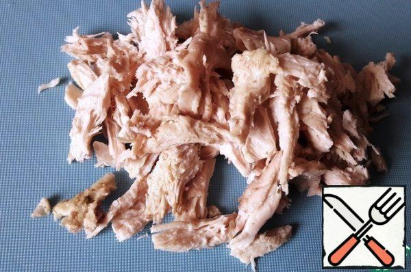 Boil the chicken, cool and split into fibers.