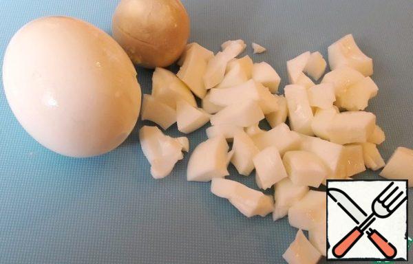 Eggs cook.
Chop the whites and yolks to leave for decoration.
