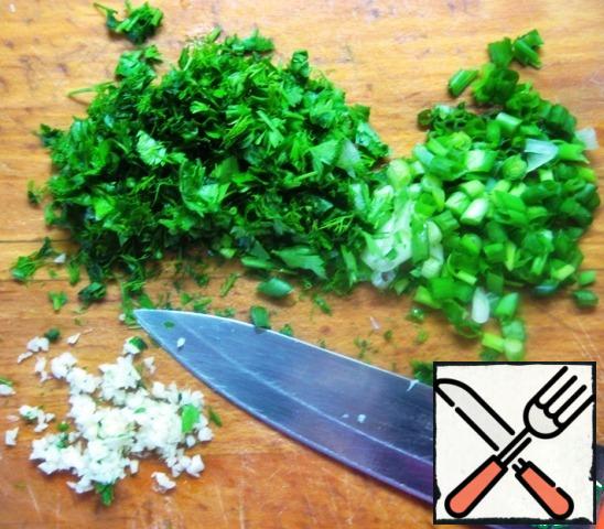 Finely chop dill and parsley, green onions. Chop the garlic clove.