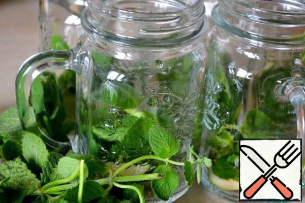 Into glasses or (which is perfect!) put bunches of mint and lime slices in the beverage bottles, rub everything in a fine mortar.
