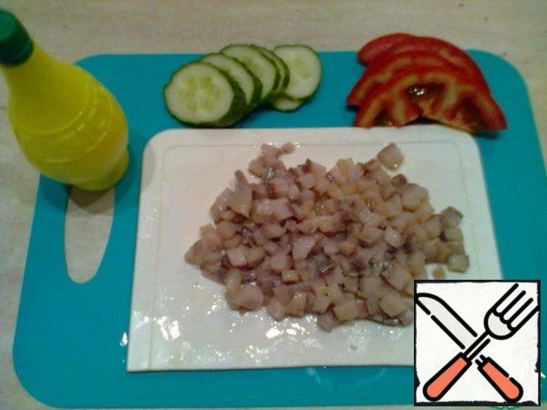 Herring fillet cut into small dice and sprinkle with lemon juice.