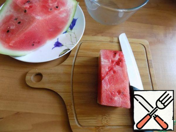 Watermelon cut into pieces, then cut it into squares with sides ~ 1.5 cm.