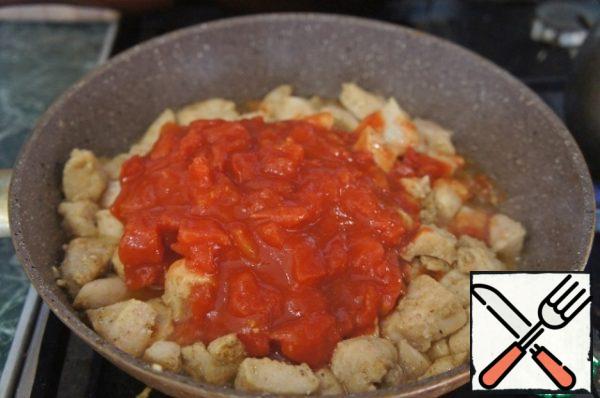 Onions cut into small cubes. Add the onion to the pan and stew all together for another 2-3 minutes, until the onions are transparent. Then add the tomatoes in their own juice, diced.