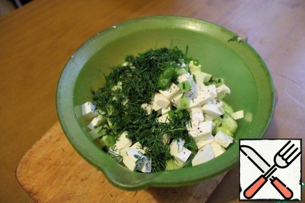 Mix cucumbers, herbs, cheese. If it is necessary, then more salt is needed. Season with olive oil. Mix it.