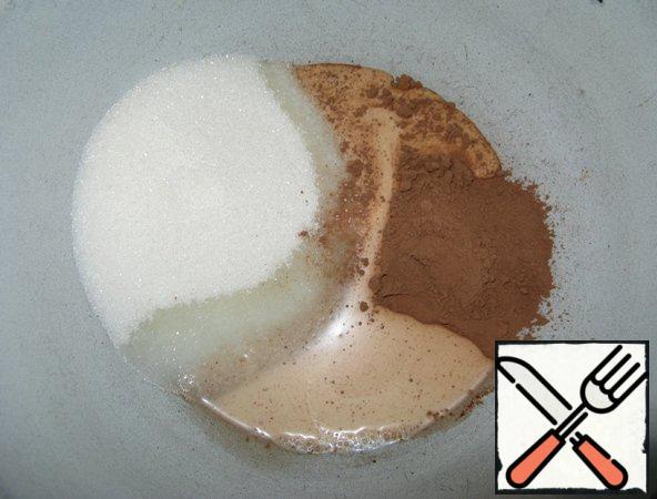 Mix sugar, cocoa and liquid milk (or cream). Put the mixture on fire and, stirring constantly, so as not to burn, bring to a boil.