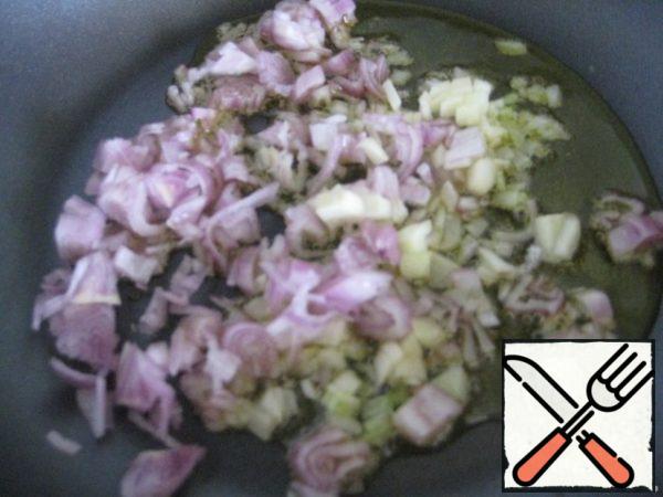 Fry finely chopped onion and garlic in olive oil (1 clove.)