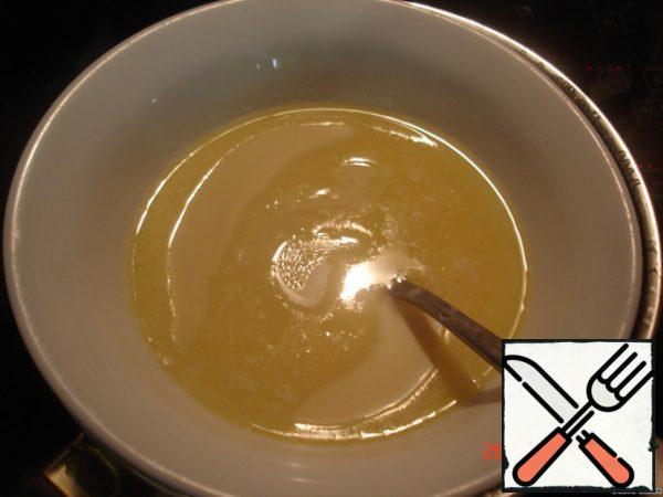 Melt butter in a water bath, add condensed milk, stirring constantly.
