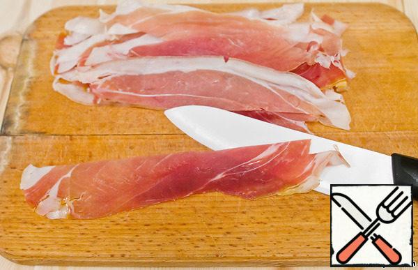 Each piece of jamon cut lengthwise into 2 parts.