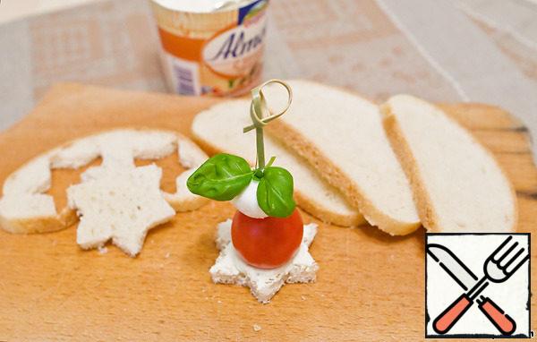 Top with tomato, pickled mozzarella and Basil leaf. Secure everything with a skewer. Serve with white wine or champagne.