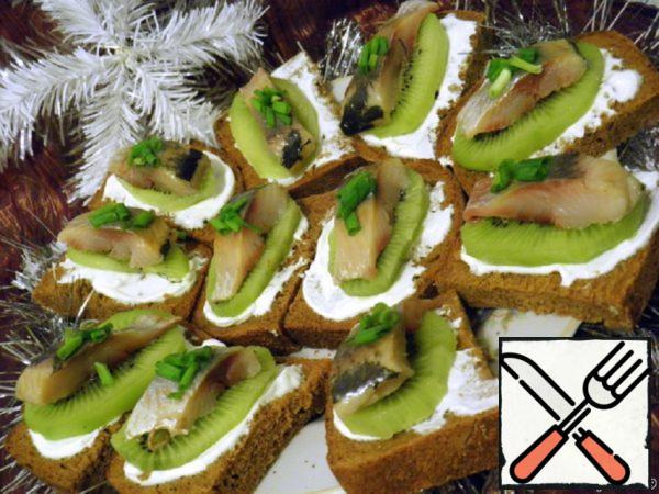 Canapes with Herring and Kiwi Recipe