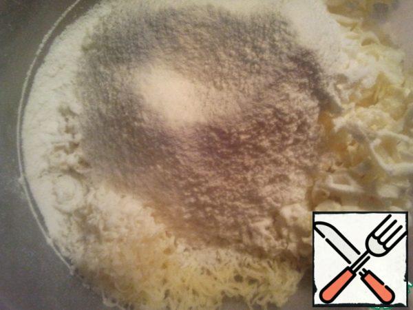 Combine cheese, butter and flour. Here we add a pinch of salt.