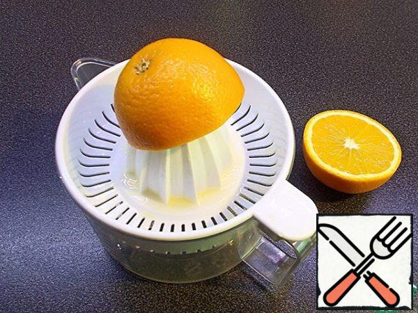 Squeeze the juice out of the orange.
