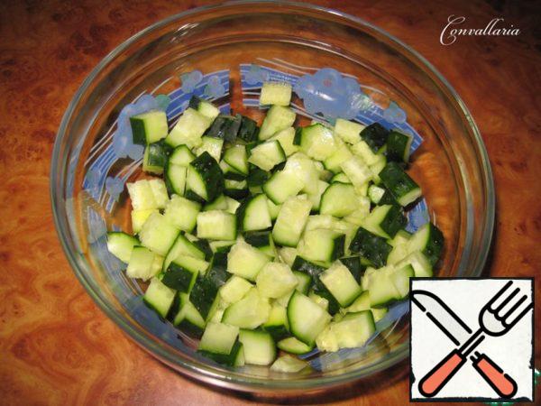 Cucumbers cut into small cubes, place in a large salad bowl.