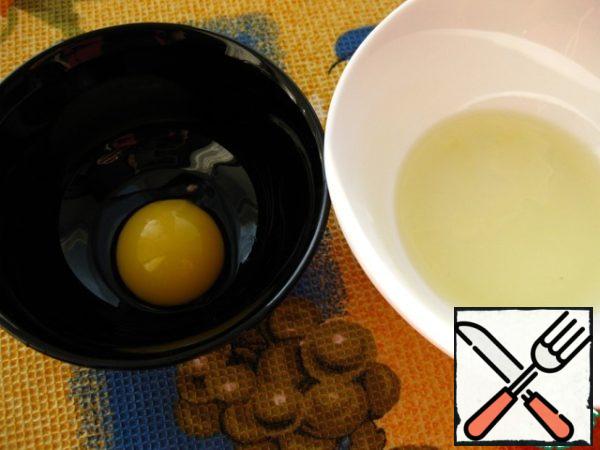 Wash the egg thoroughly. Separate the egg white from the yolk.