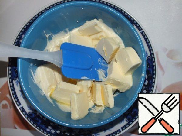 Melt white chocolate with butter in a water bath.
