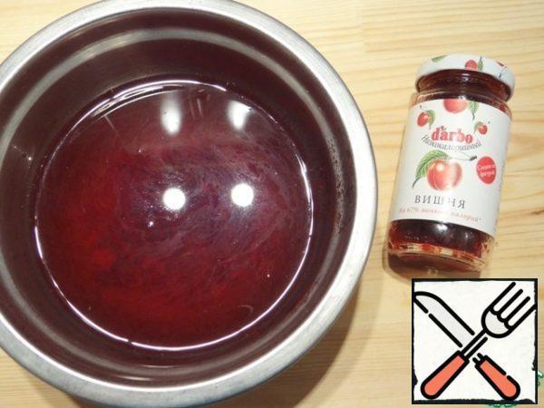 Prepare cherry jelly. Instant gelatin for cherry jelly pour 1/2 part of hot boiled water (necessary for soaking gelatin), stir until completely dissolved, strain. Put the required amount of low-calorie cherry jam in a bowl, add warm boiled water, mix.
