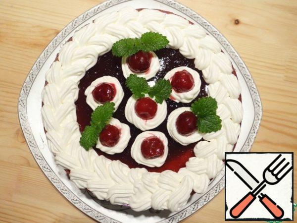 I take the cheesecake out of the form, shift it to the dish. Decorate it with whipped cream, cherries and fresh mint. Enjoy your meal!