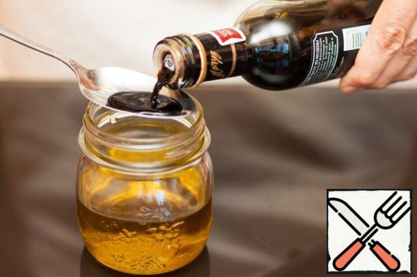 Add the wine vinegar to the olive oil.
